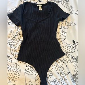 H&M black ribbed body suit- Size M brand new condition